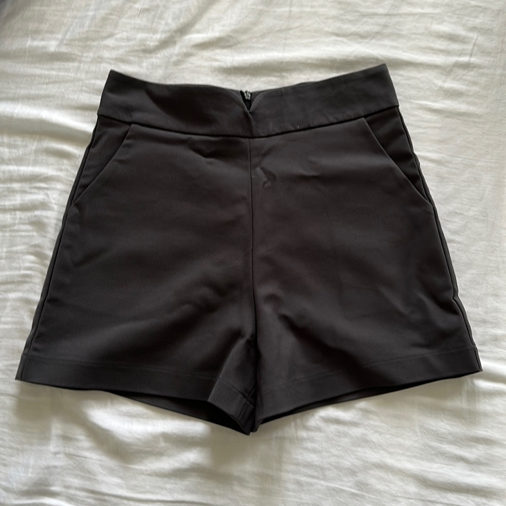 Tailored shorts with v dip waist detail